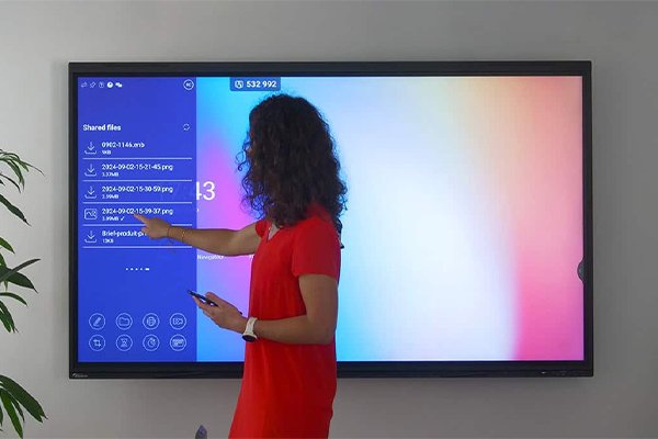 Customer sharing files on an E-UNIWILL interactive display during a training session